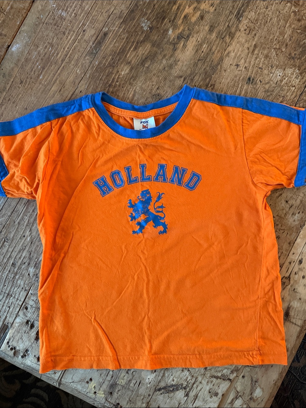 Fox Orange Tee with Blue Holland Lion Graphic